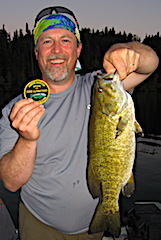 Fishing Trophy Smallmouth Bass at Dusk by Dan